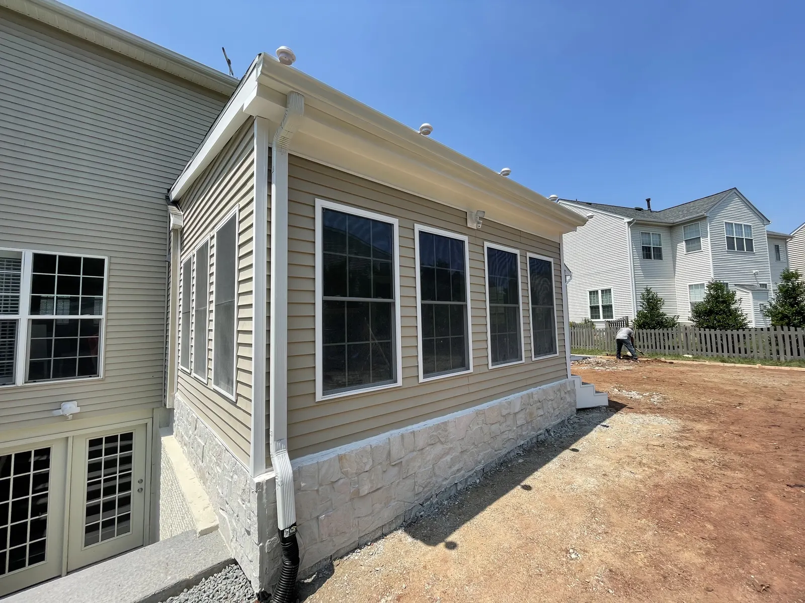 Seamless gutter installation on a residential home