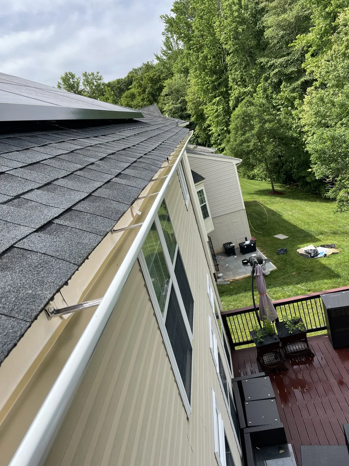 Gutter repair work on residential roofline